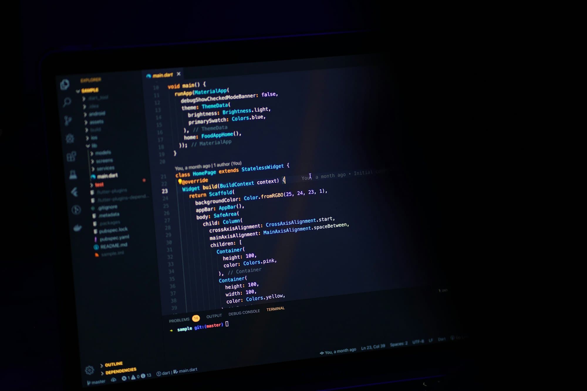Screen showing source code in a dark room